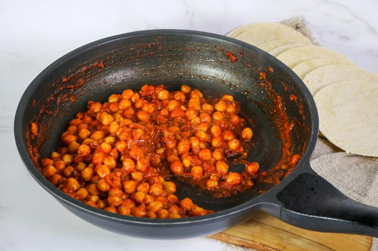 Vegan buffalo chickpea taquitos filling in pan