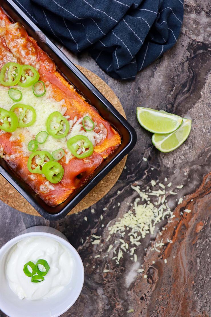 Vegetarian enchilada with spinach and cheese topping