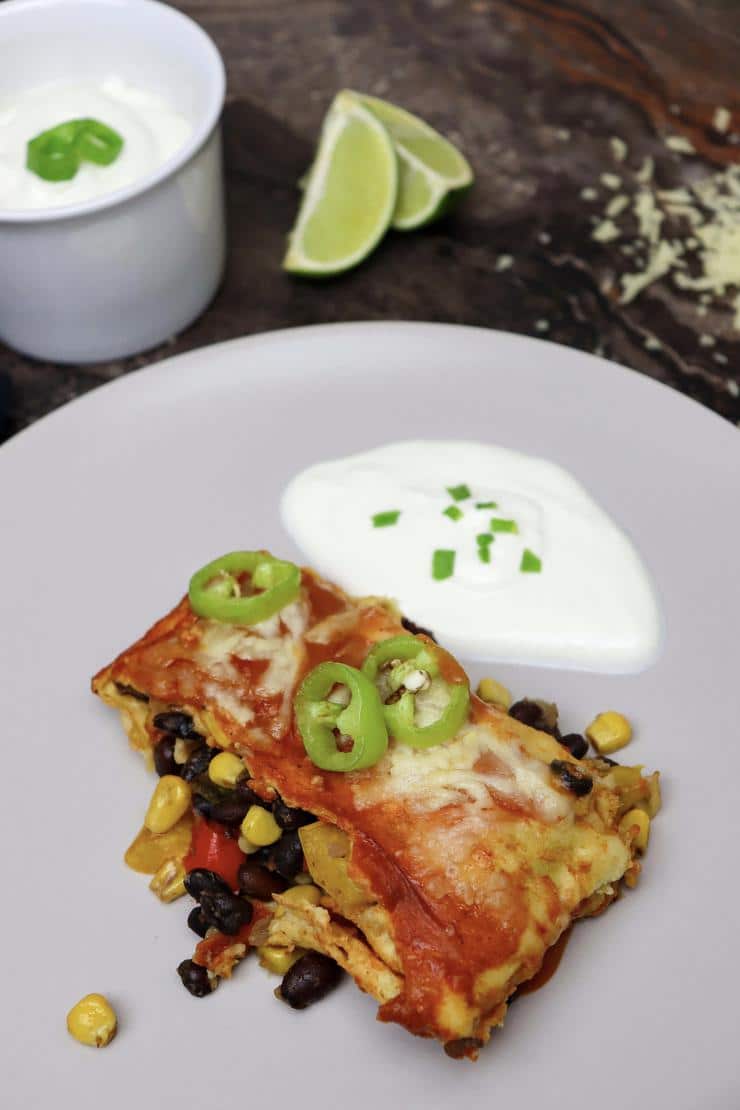 Vegetarian enchilada with spinach on plate