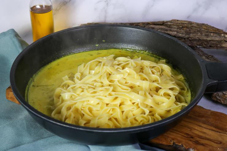 Vegan fettuccine alfredo pasta in frying pan